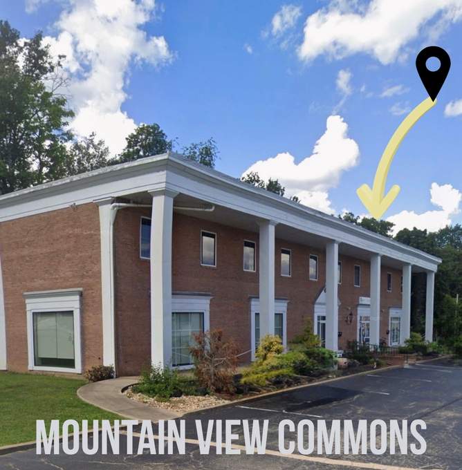 Mountain View Commons building with colonnade and brick exterior, a location pin indicating its location.