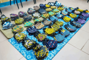 A bunch of bags are laying on a blue mat
