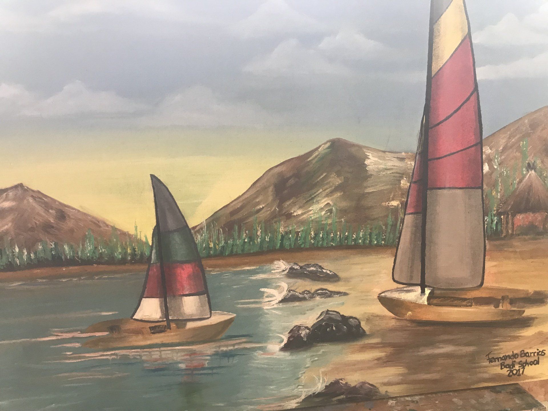 A painting of two sailboats in the ocean with mountains in the background.