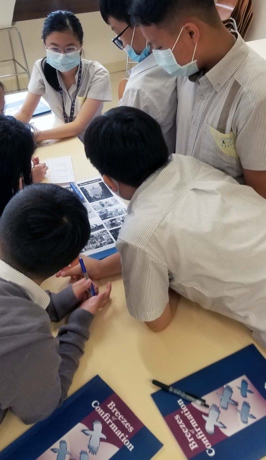 Two students reading an article titled 