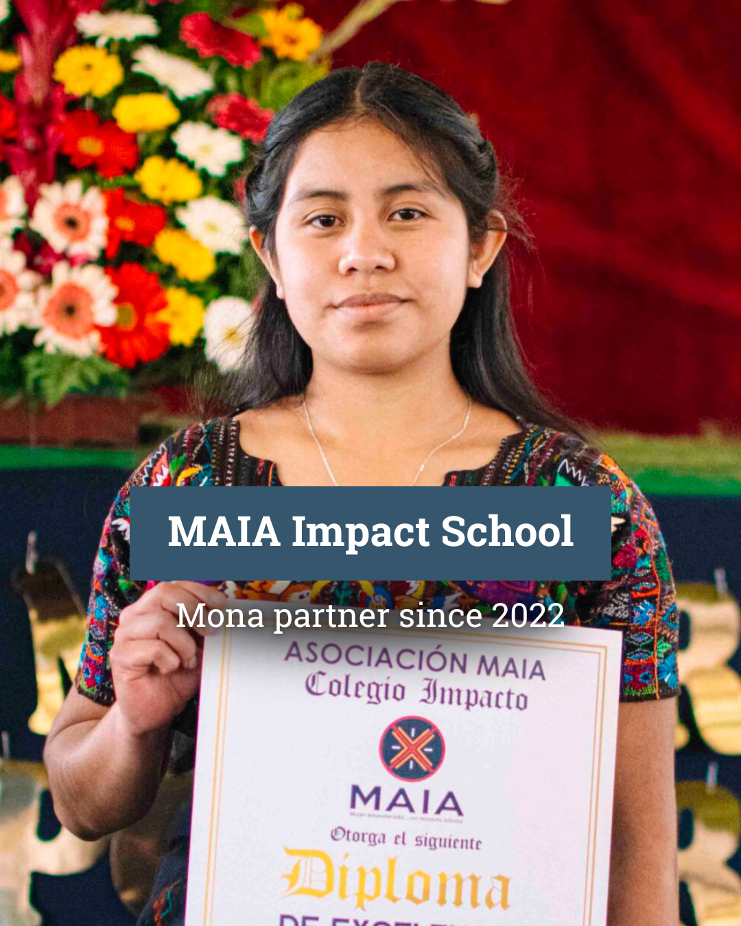 A woman is holding a certificate in front of a flag.