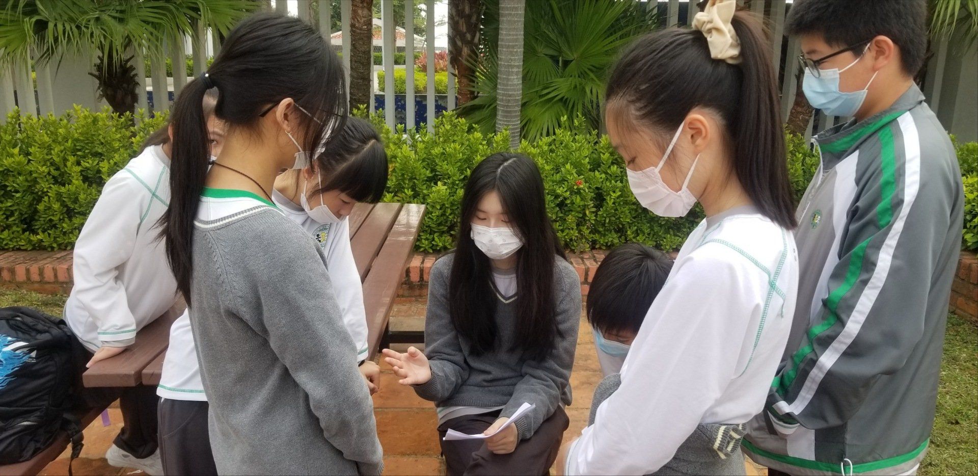 A small group of students working together on a project. 