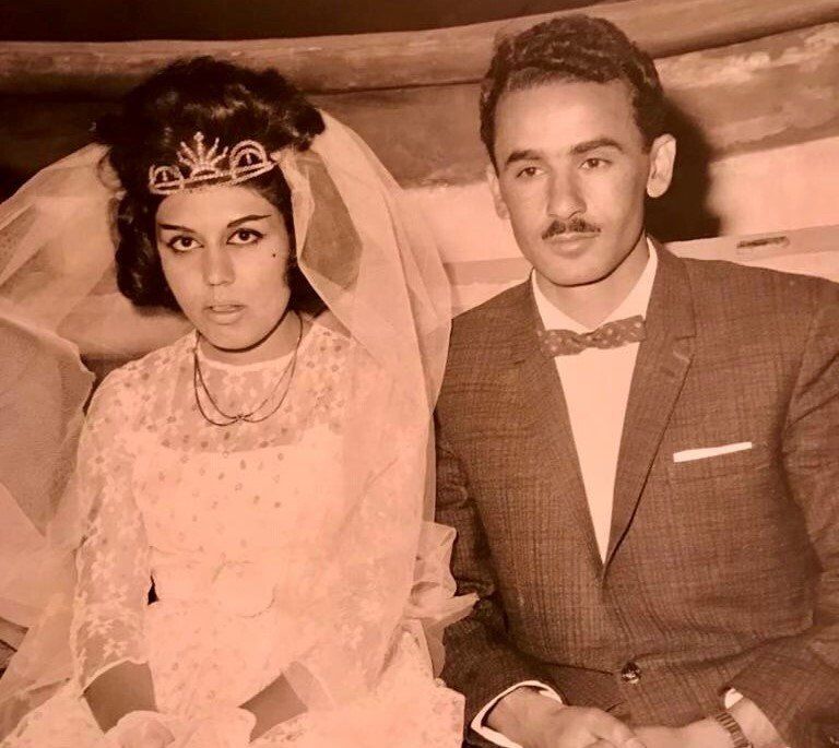 A black and white photo of a bride and groom