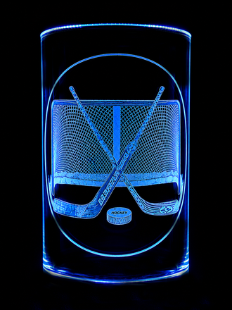 Neon blue glowing face in a glass, with crossed hockey sticks and a puck on a black background