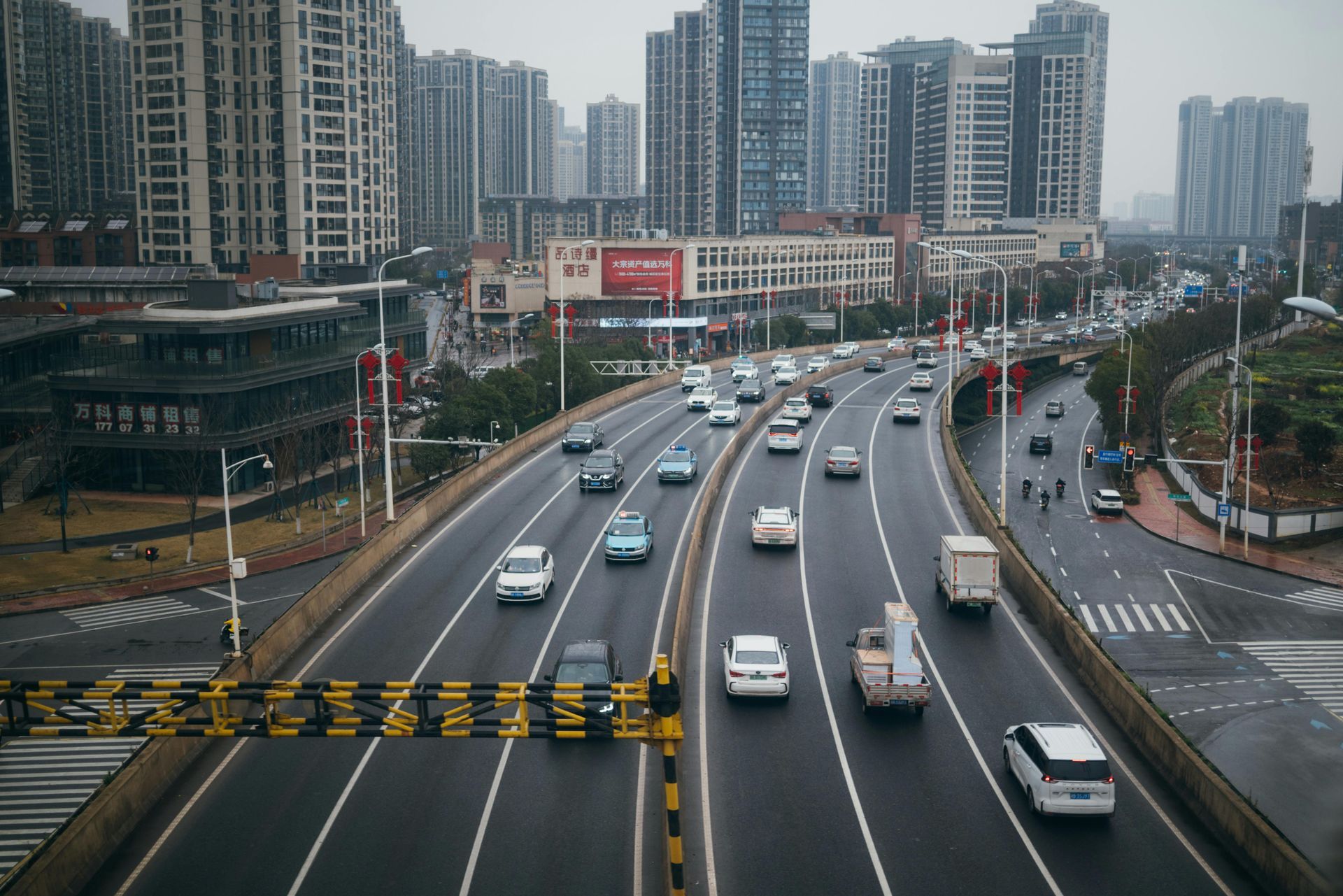 Our Mission A busy urban highway with multiple traffic lanes, representing the transportation sector.