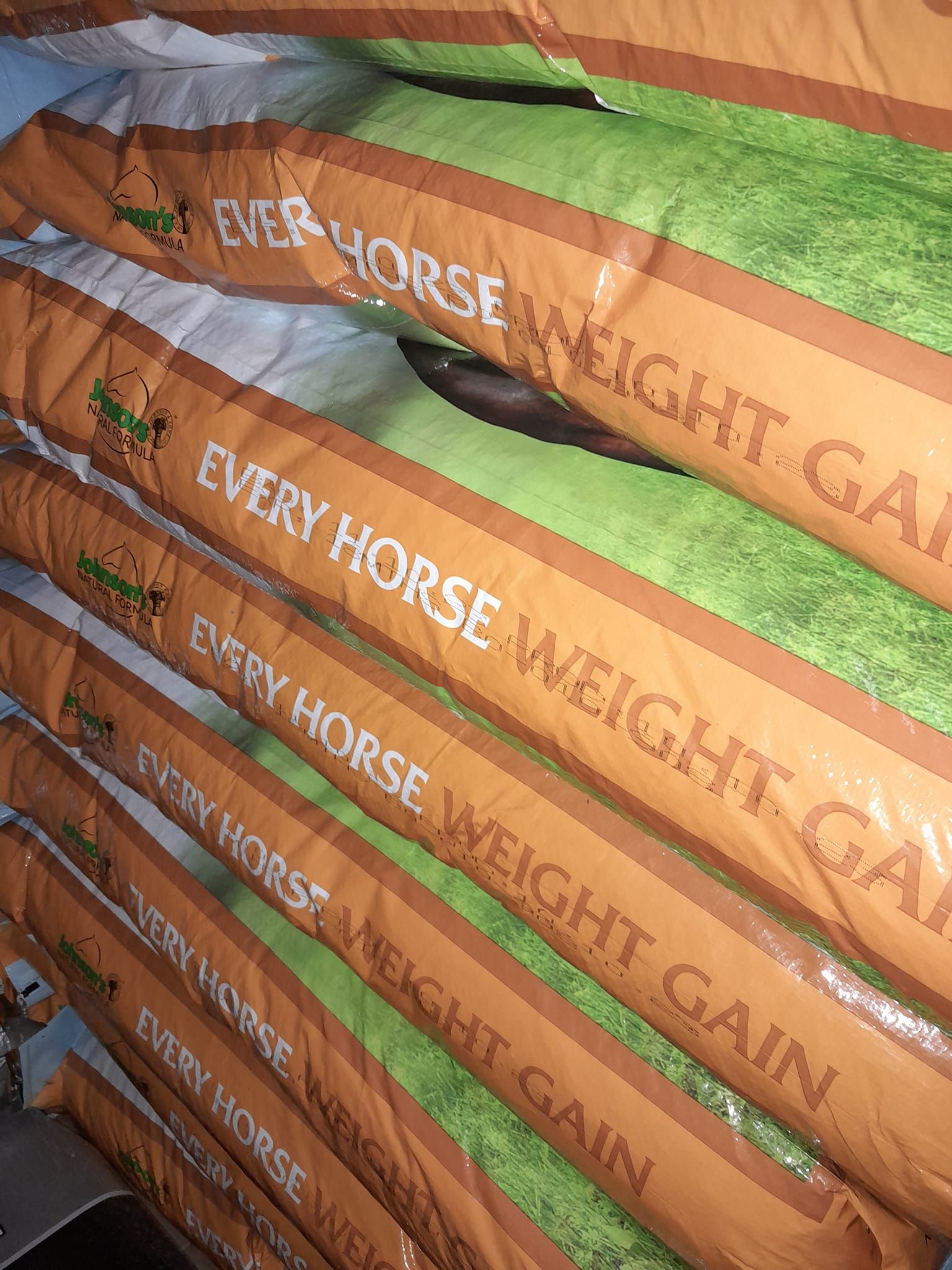 Bags of animal food pilled on the ground — Farm and Home in Nabiac, NSW