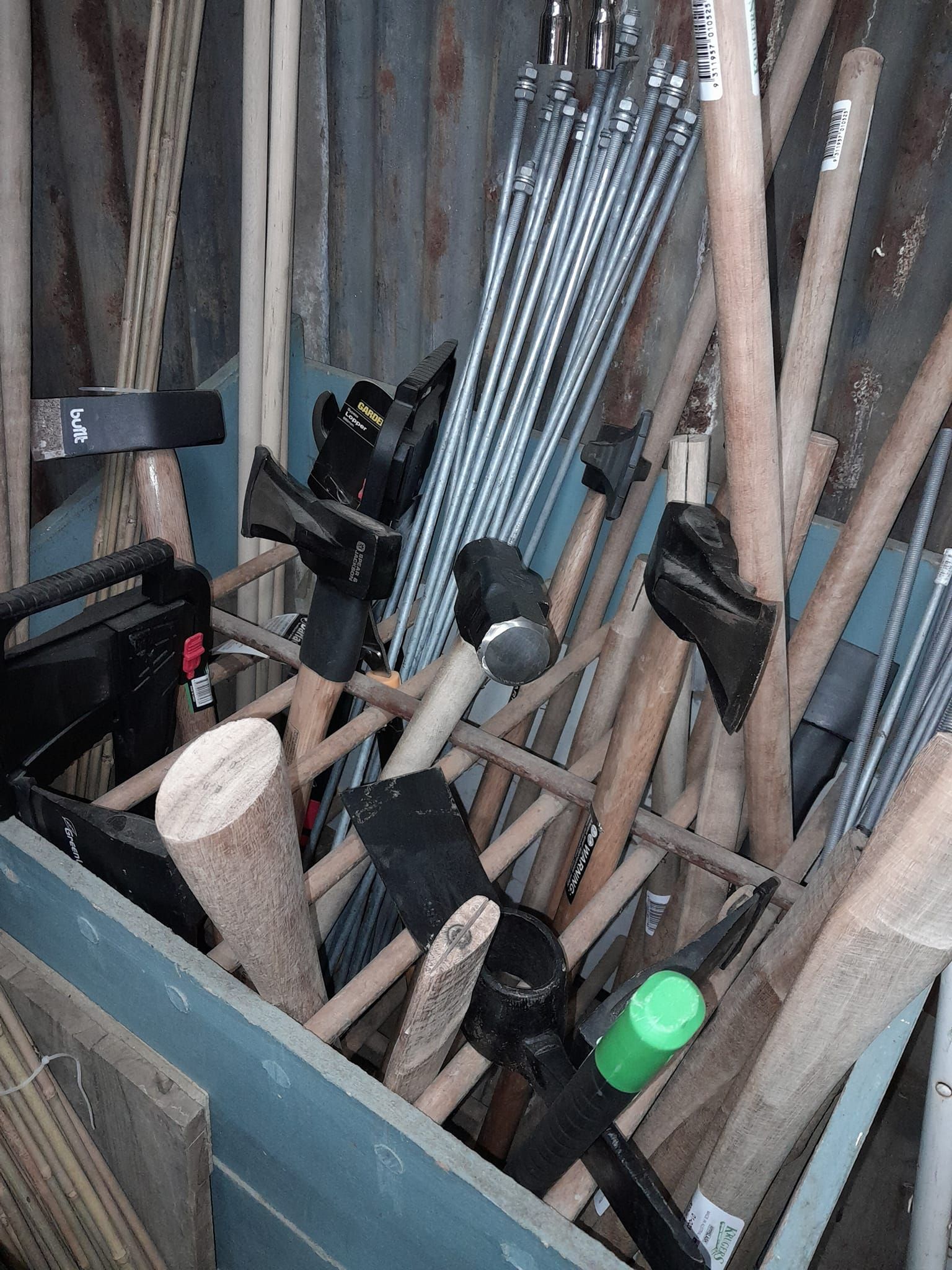 A warehouse filled with lots of shelves and plumbing equipment — Farm and Home in Nabiac, NSW