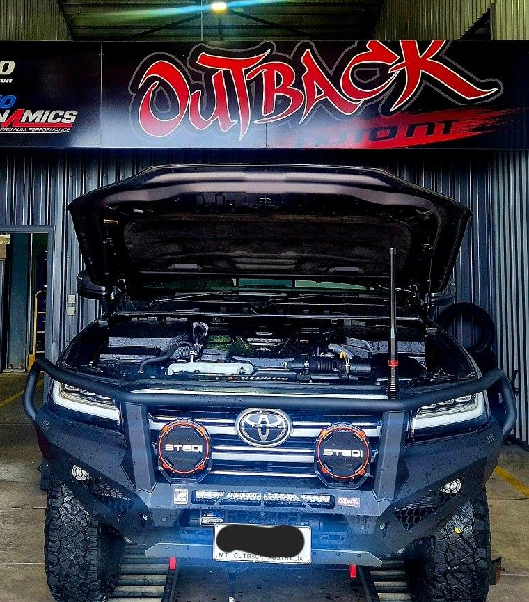 Blue Toyota SUV with hood open, showing engine bay in front of an Outback Offroad shop  — Outback Auto NT in Berrimah, NT