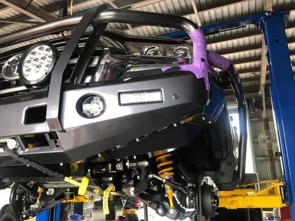Vehicle Raised on a Workshop Lift — Outback Auto NT in Berrimah, NT