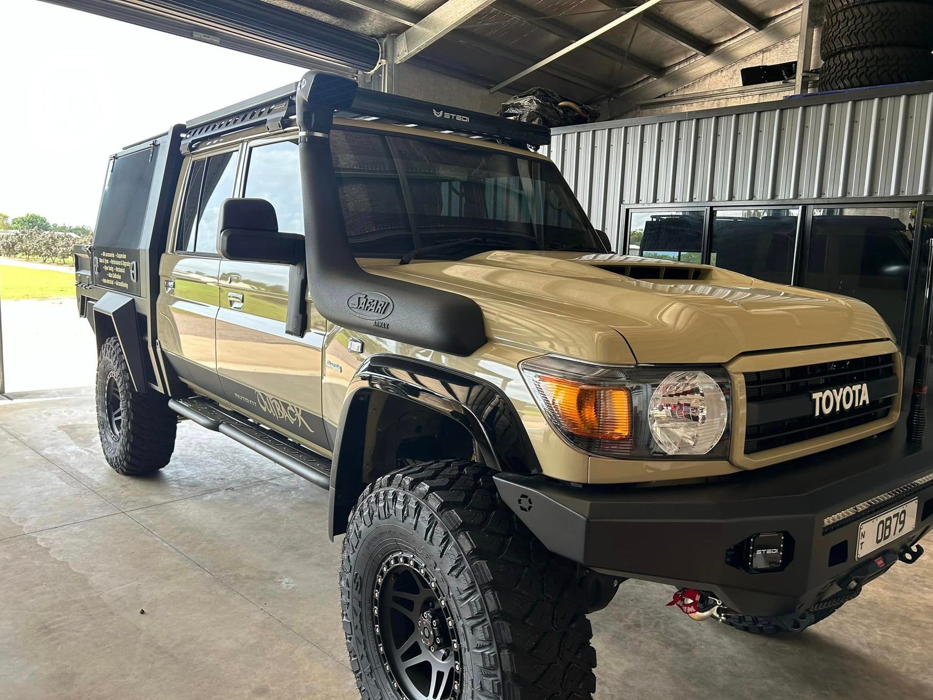 A Four Wheel Drive Car In A Garage