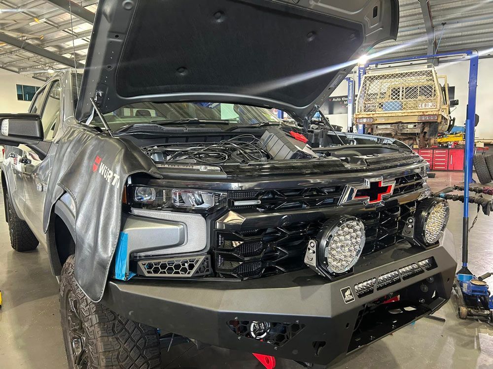 Black Chevrolet Truck With the Hood Open in a Workshop — Outback Auto NT in Berrimah, NT