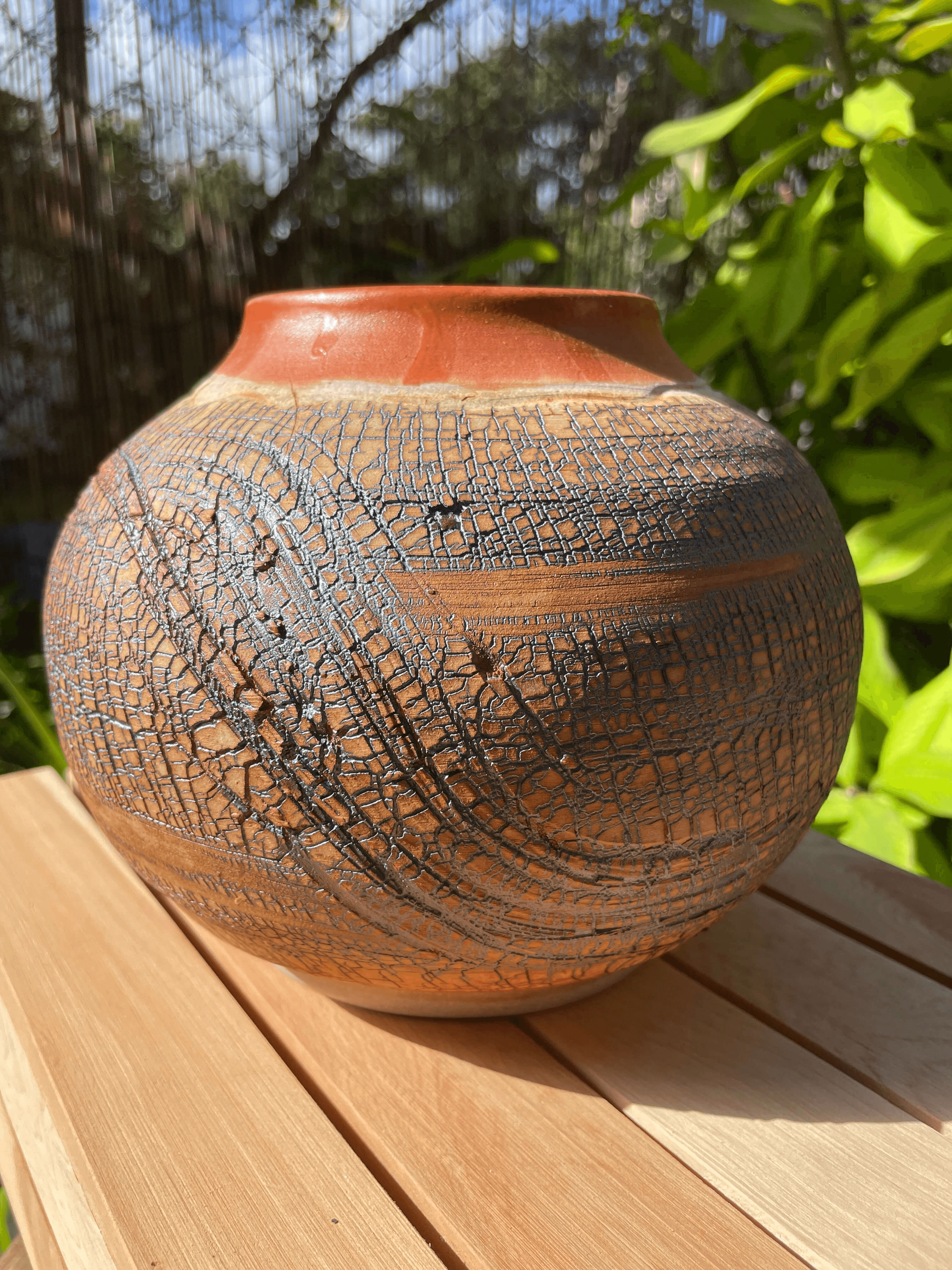 a custom ceramic vase made with a unique glazing technique to add textures and artistic cracks