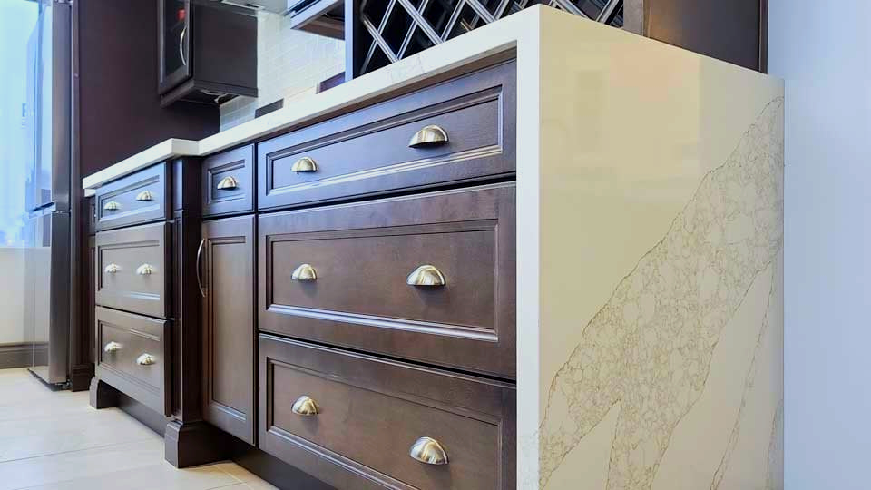 Kitchen cabinets with classic brown drawers and bronze handles