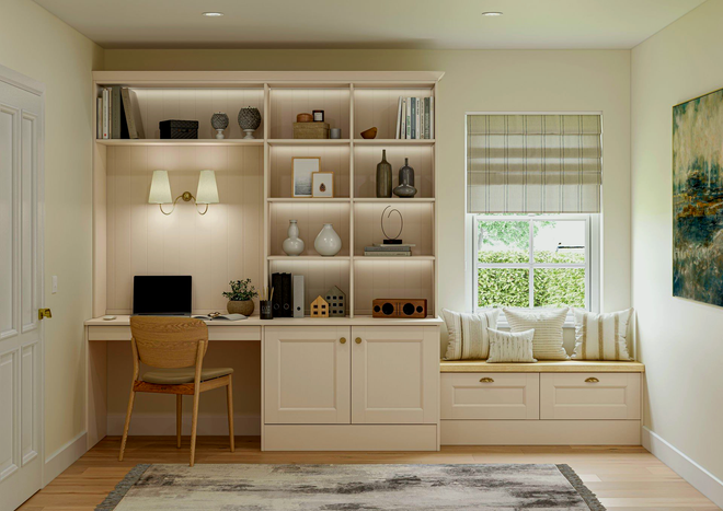 A home office with a built-in desk and bookshelves, a window seat, and a woven chair. The room is beige with a light rug.