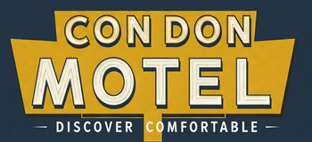 A yellow sign that says condon motel on it