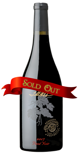 A bottle of 2017 Pinot Noir wine with a red 