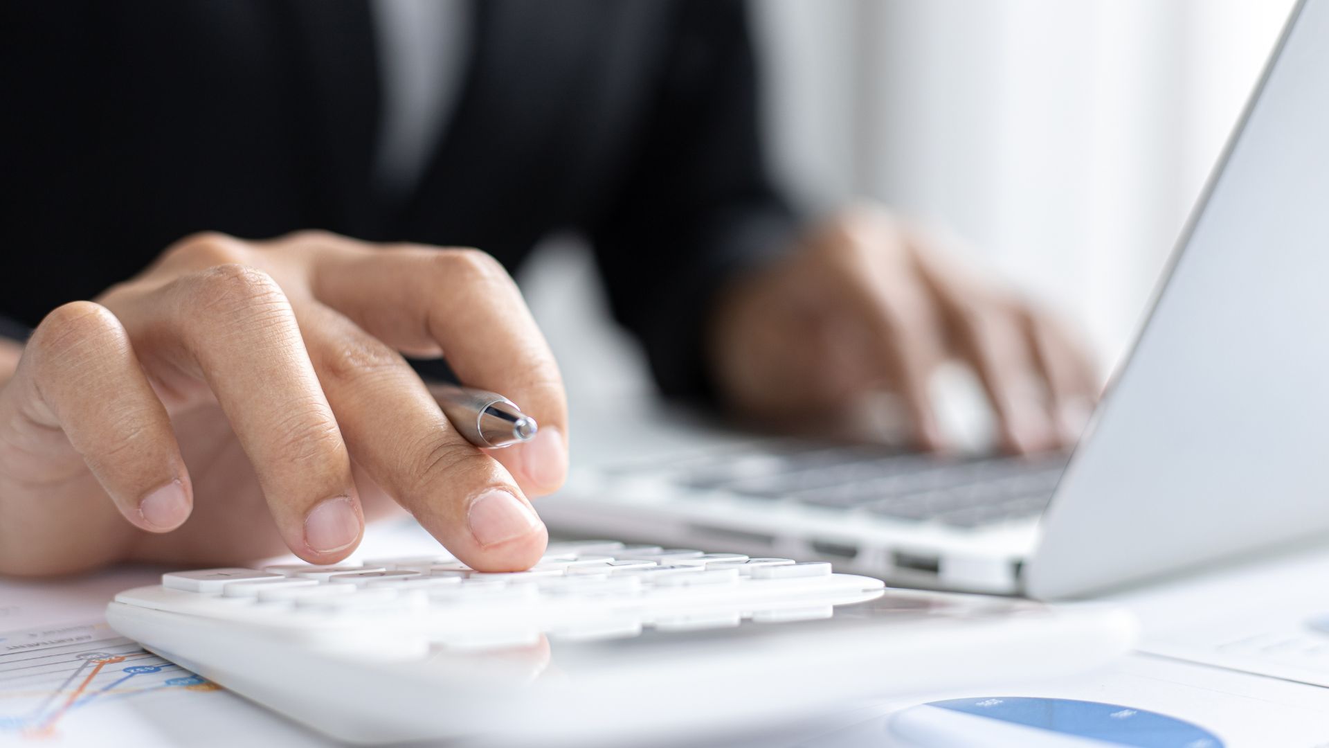 Financial advisor explaining tax-deductible expenses to a business owner

