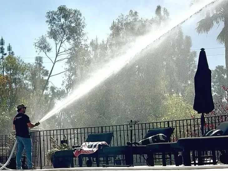 trigger-point-wildfire-point-home-protection-home-man-using-fire-hose-image