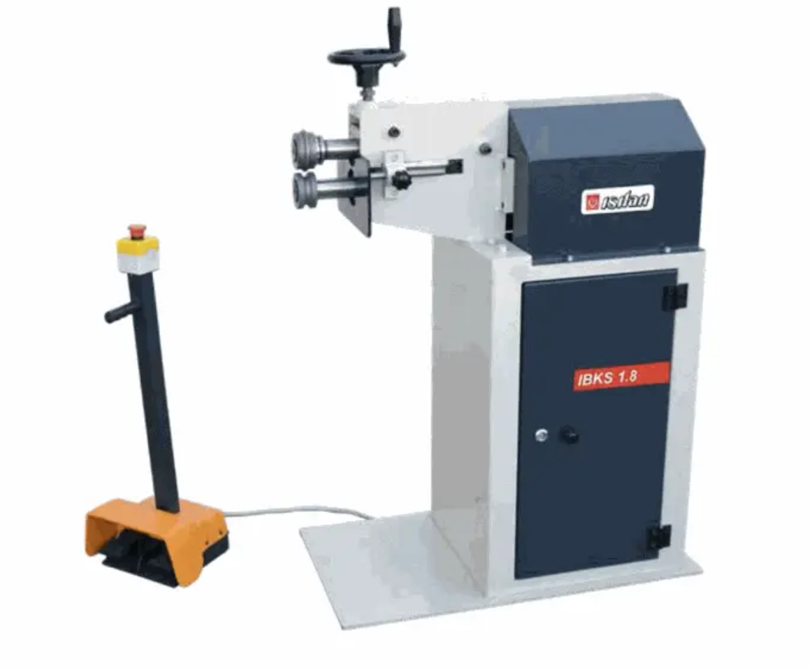 A machine is sitting on top of a white table.