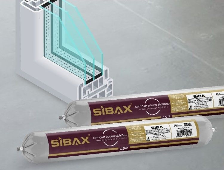 Two tubes of sibax are sitting next to a window.