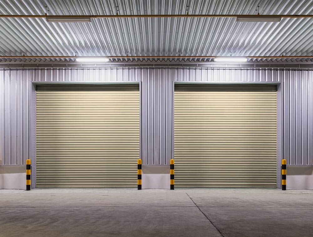 There Are Two Garage Doors in the Warehouse — Mackay Garage Doors in Andergrove, QLD