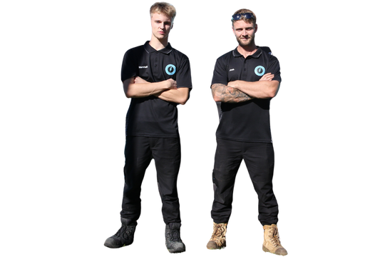 Two men in black polo shirts and pants standing with arms crossed on a white background