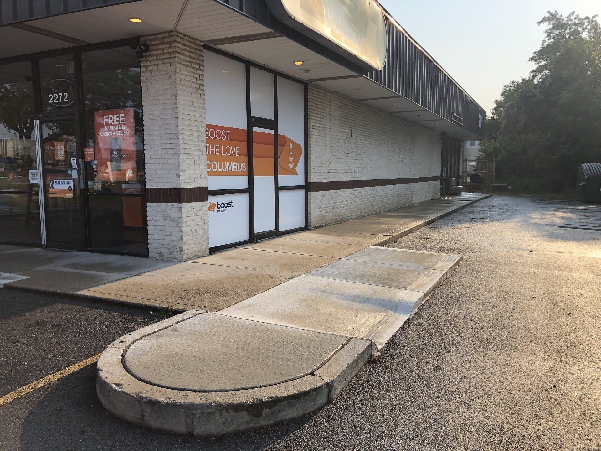 Man Cleaning Walkway Using Water Pressure Washer — Dublin, OH — Elite Softwash