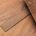 Three overlapping brown wood-grain panels with diagonal edges on a textured surface