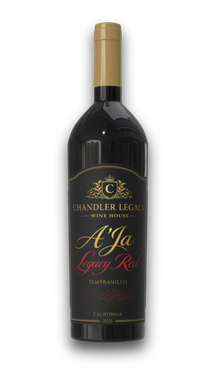 Bottle of Chandler Reach Aja red wine with gold cap and black label on a white background