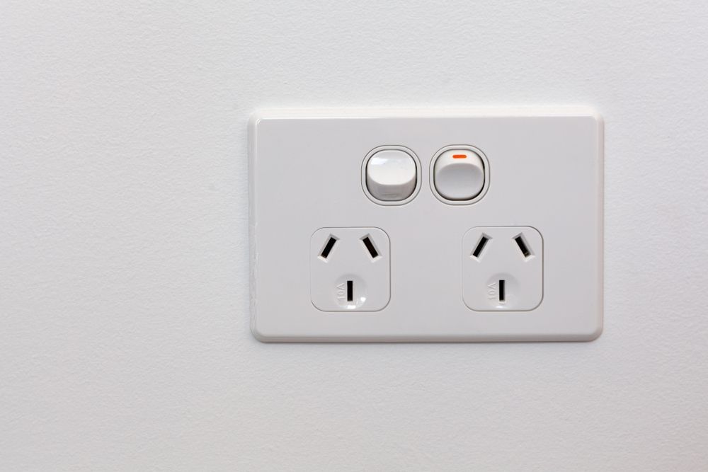 White Wall-mounted Electrical Outlet With Two Sockets and Two Light Switches — Holders Electrical In Tenterfield, NSW