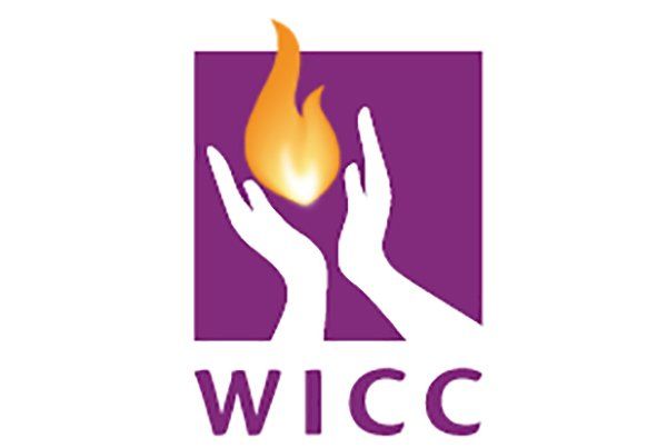 A logo for wicc with two hands holding a flame