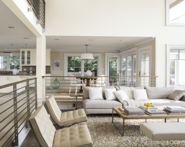 A living room with a couch and chairs in it