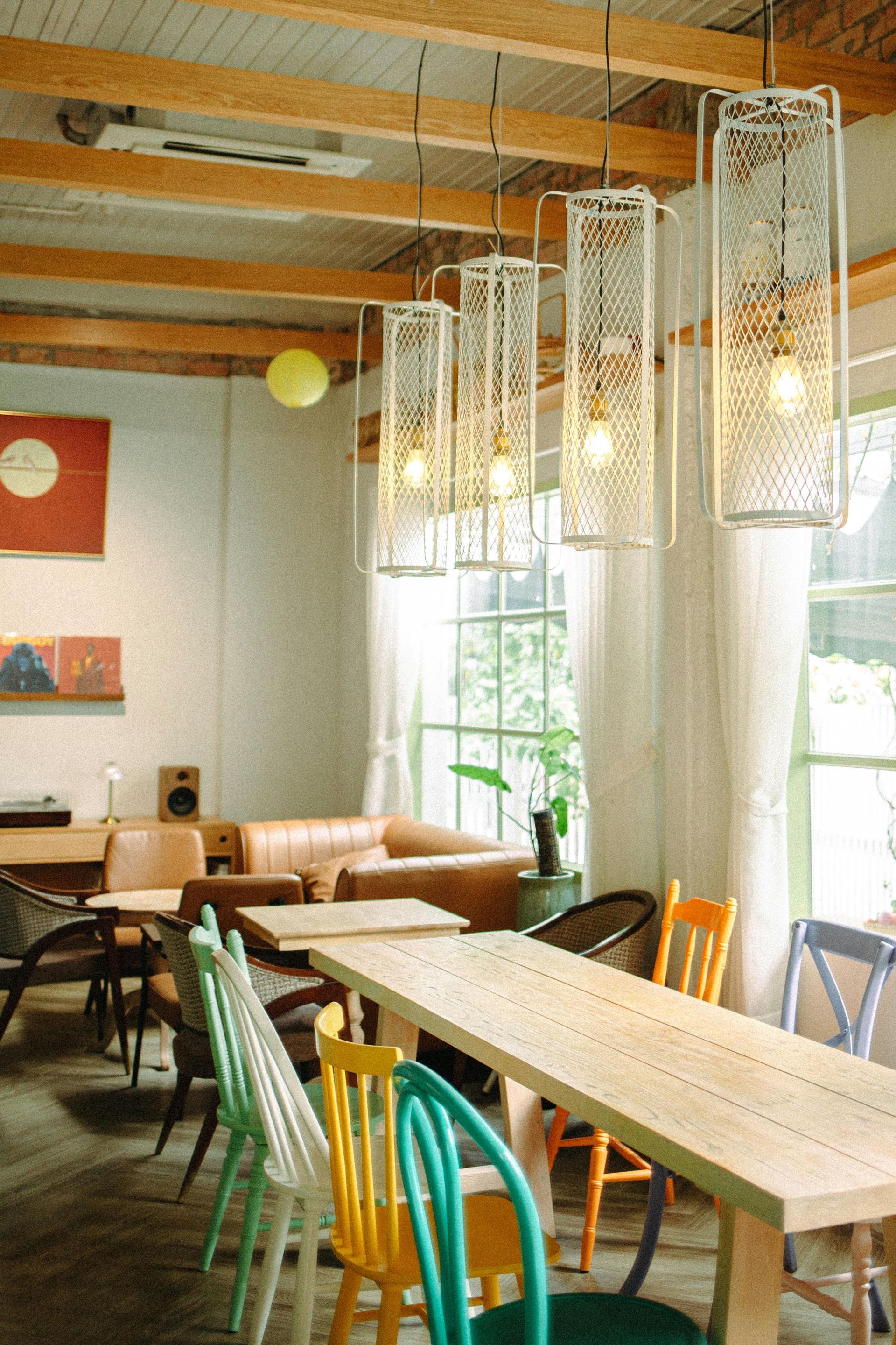 A restaurant with tables and chairs and a couch
