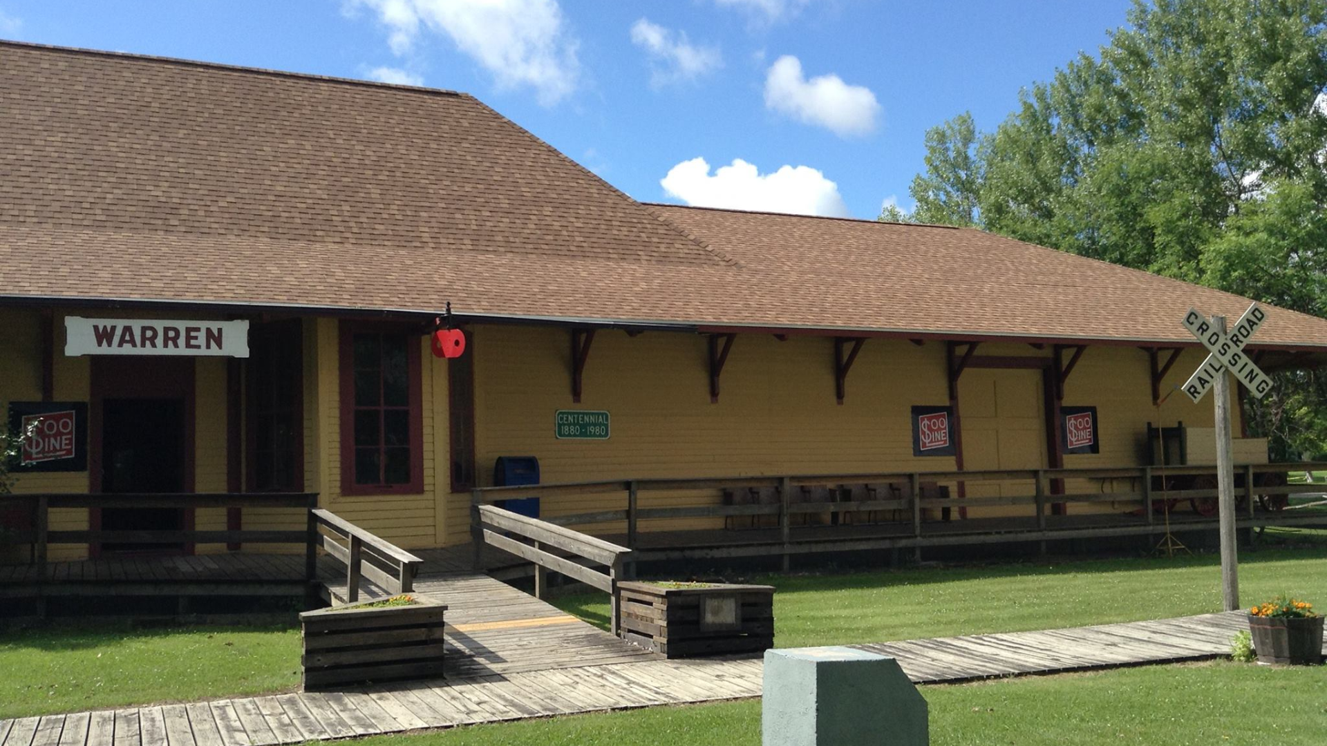 A tan, historic railroad depot building labeled