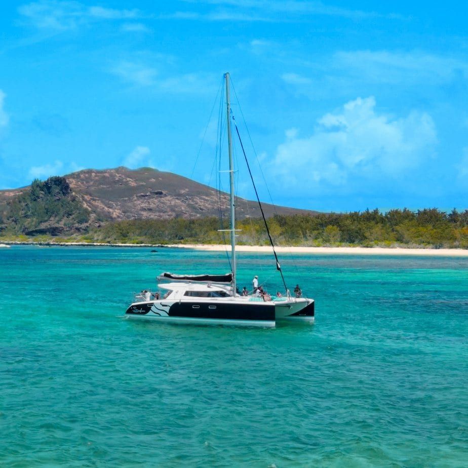 Catamaran sailing in the turquoise lagoon of Mauritius