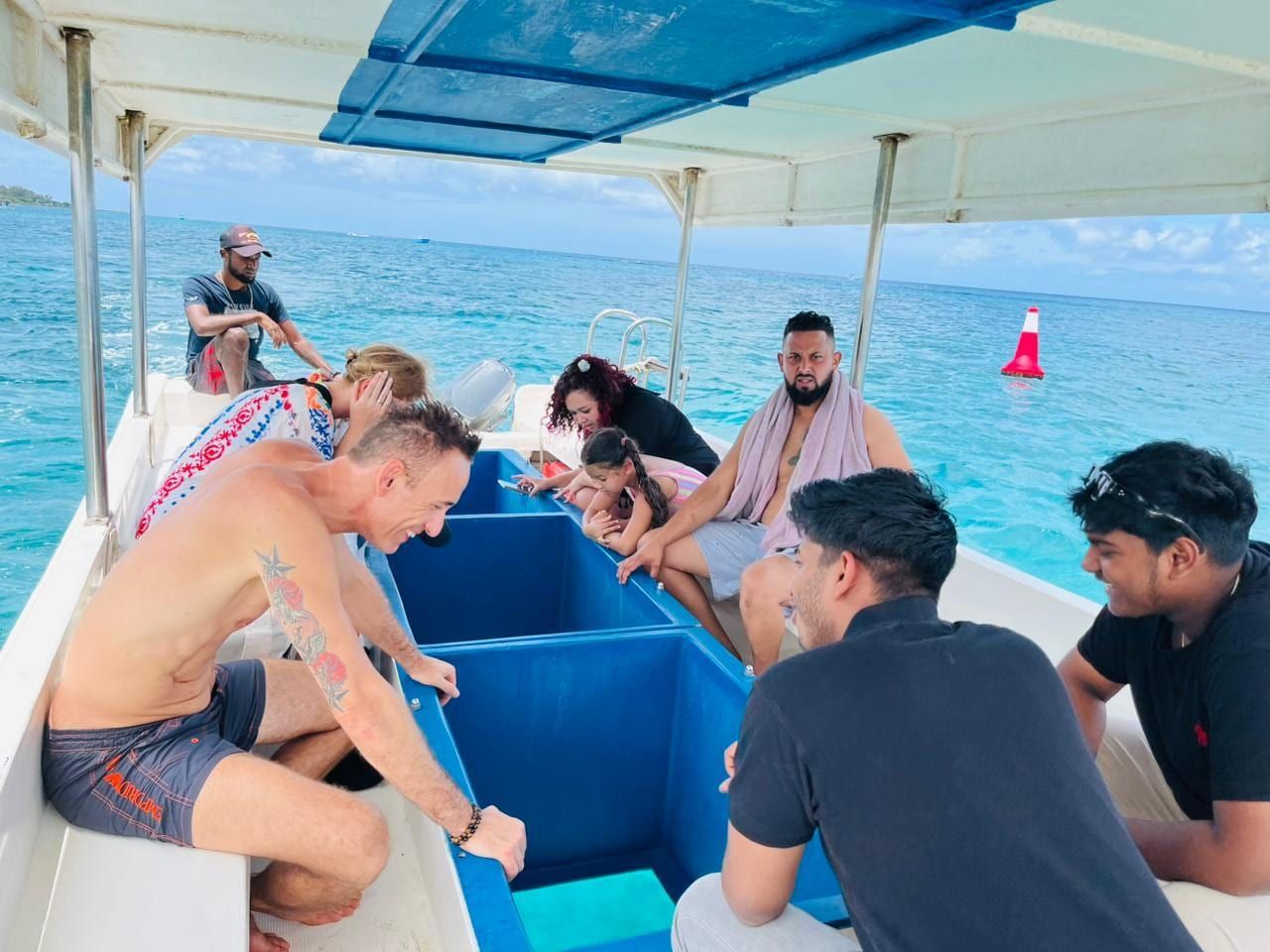 Snorkellers on a private boat over the reef in Trou aux Biches, Mauritius