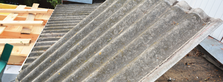 A piece of roofing material is sitting on top of a roof.