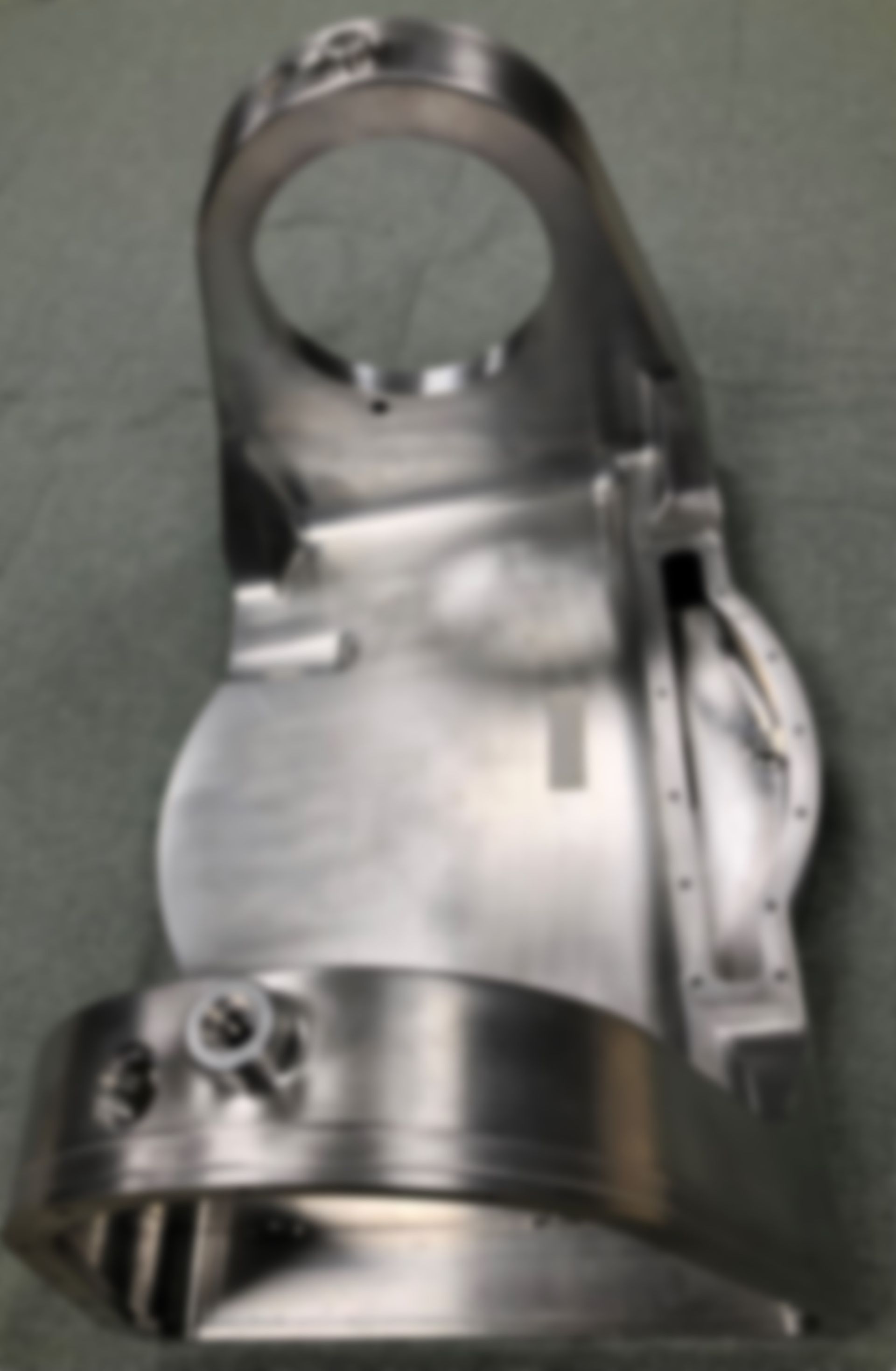 A close up of a metal object with a hole in the middle