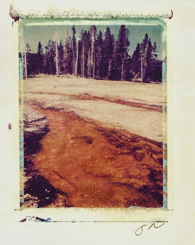A picture of a river with trees in the background