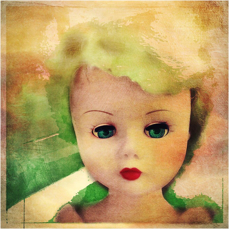 A painting of a doll with green eyes and red lips
