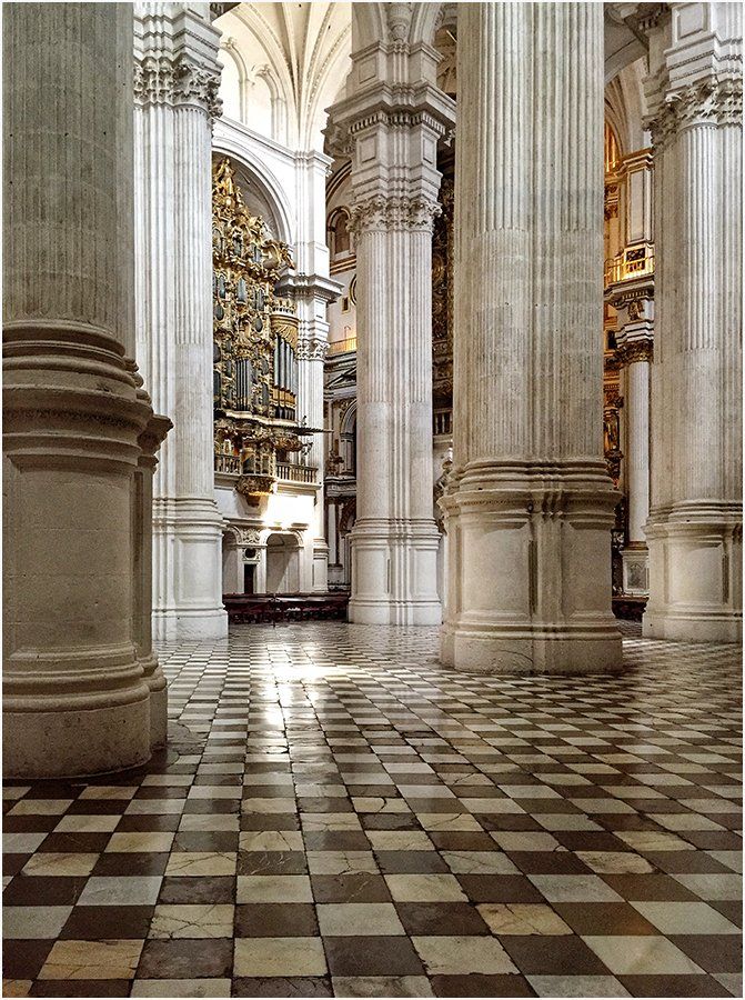 A church with columns and a checkered floor