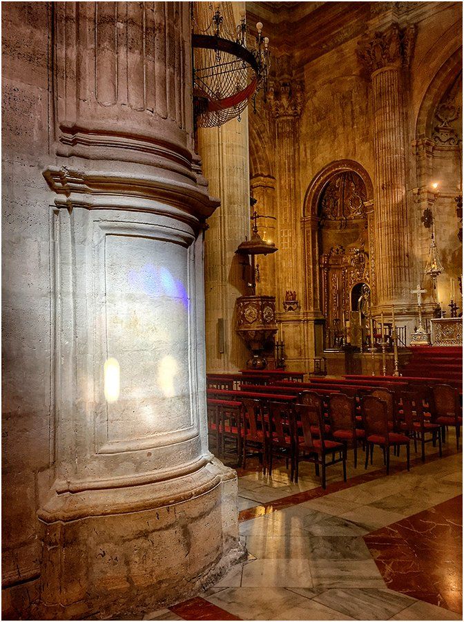 A church with a pillar in the middle of it