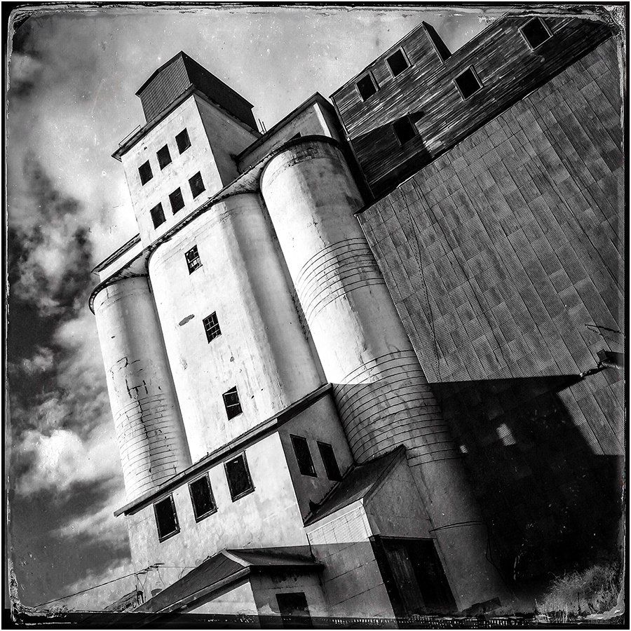 A black and white photo of a very tall building
