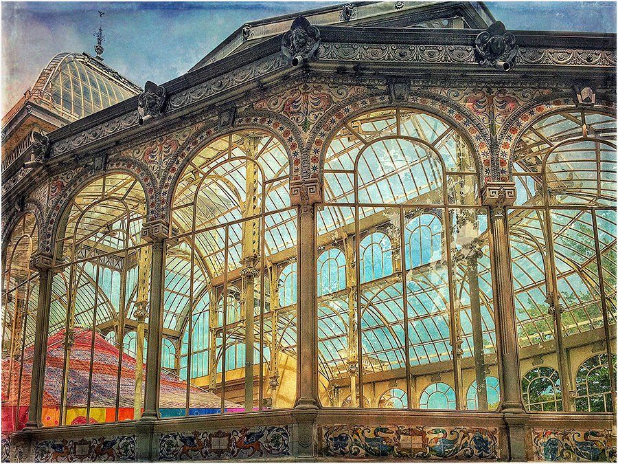 A large building with a lot of windows and arches.
