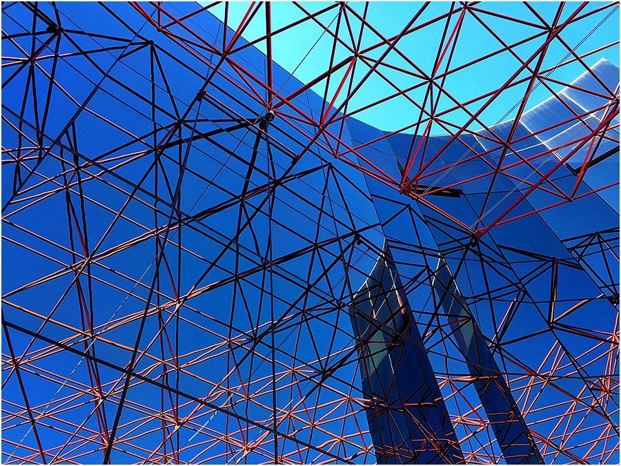 Looking up at a building with a blue sky in the background