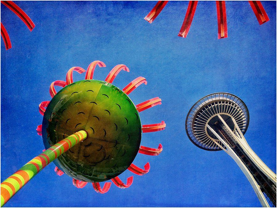 A painting of a green object with red ribbons against a blue sky