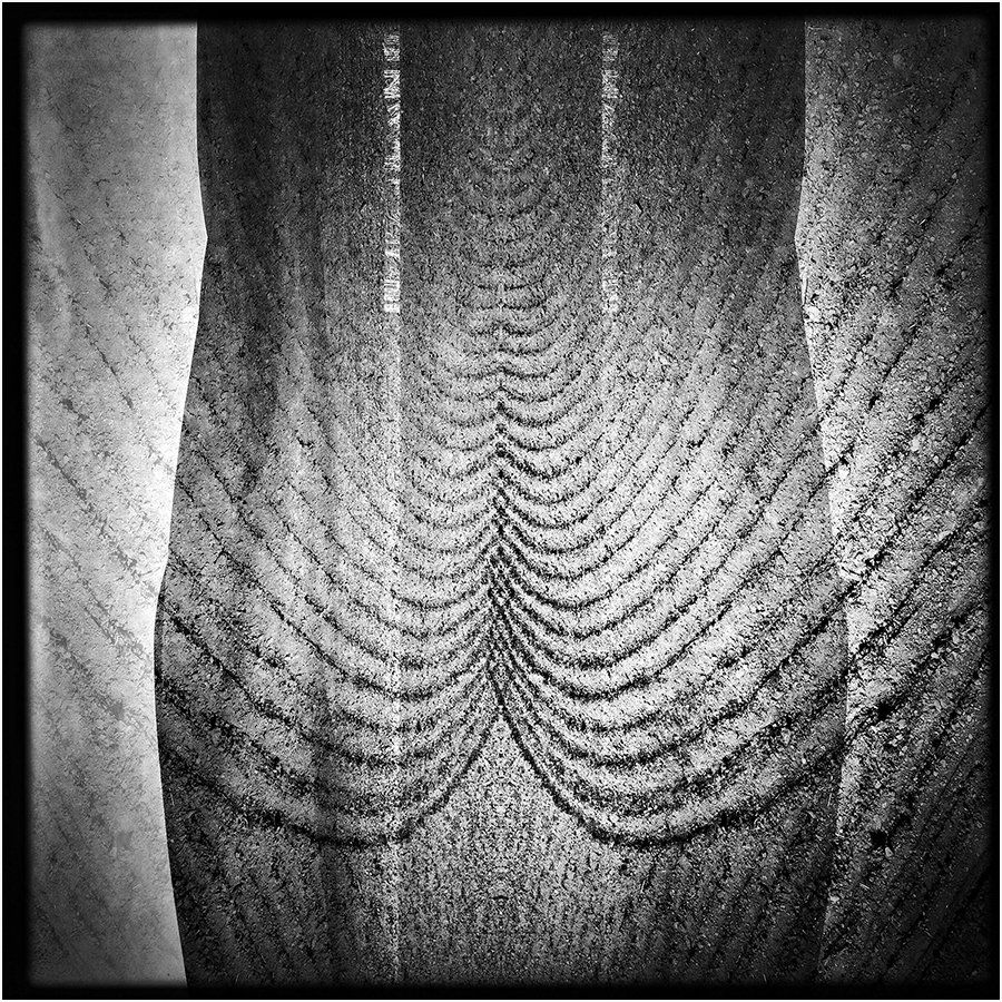 A black and white photo of a rope texture