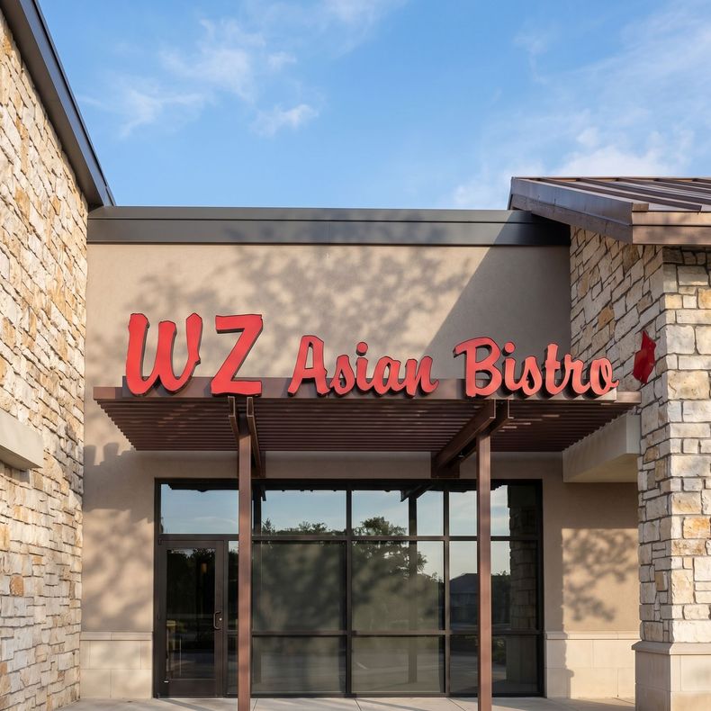 WZ Asian Bistro sign above a stone-front restaurant entrance with glass doors