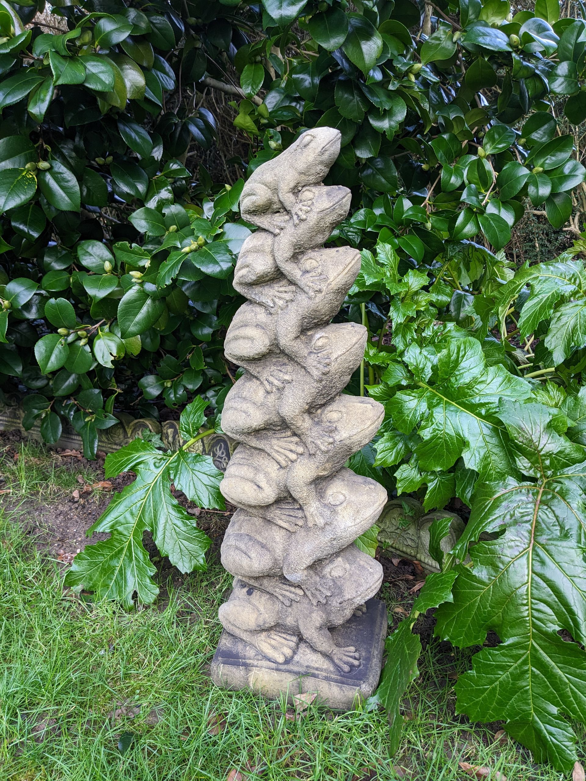 frog chorus pile of frogs amphibians toads stone garden statue