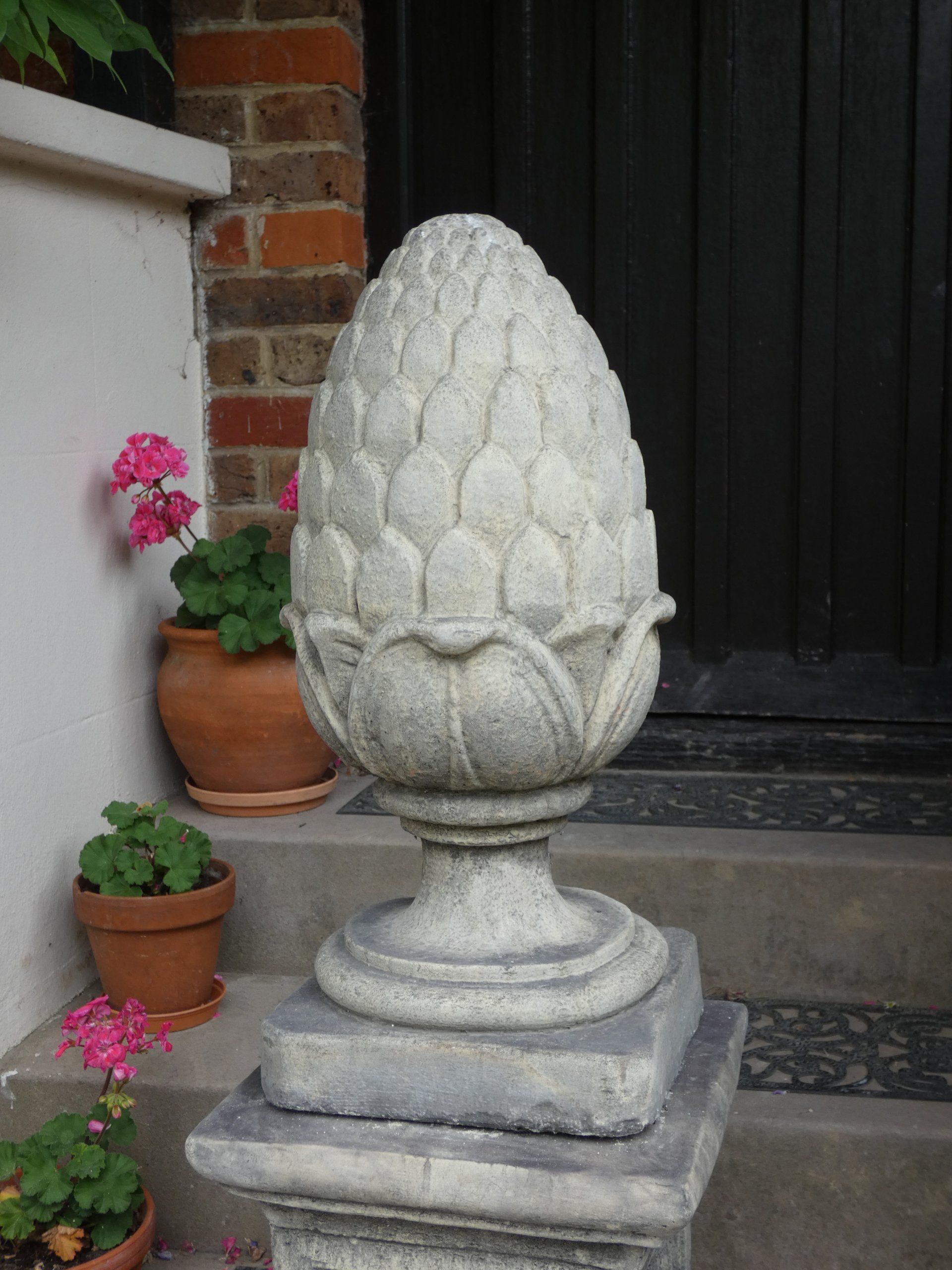 large fir cone stone garden statue